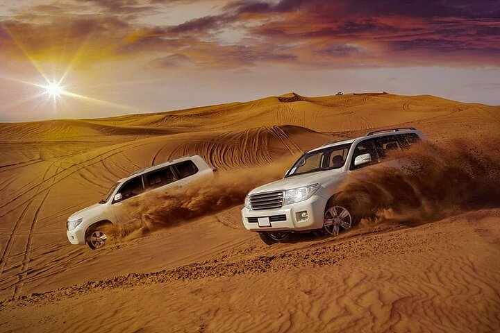Experience the thrill of desert adventures with 4 Activities in 1 package Dubai. Feel the excitement of dune bashing while surrounded by stunning desert landscapes at sunset.